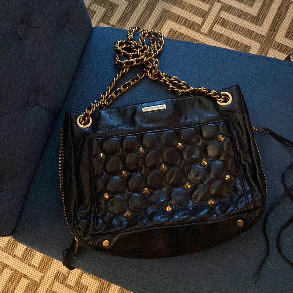 Rebecca Minkoff shiny black leather with gold accents.